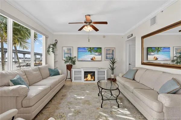 a kitchen with stainless steel appliances white cabinets and a stove top oven