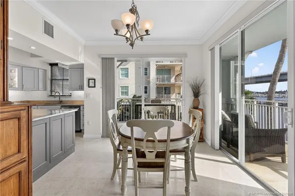 a kitchen with stainless steel appliances granite countertop a sink stove microwave and refrigerator