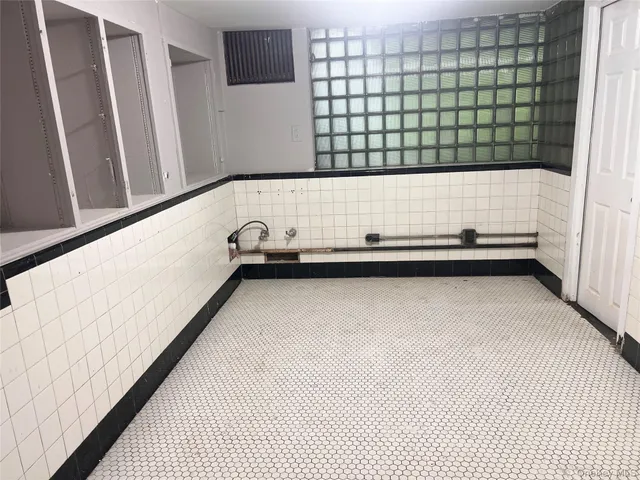 a view of wooden floor and windows in a room