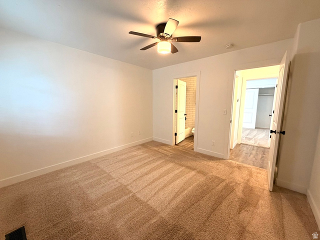 11895 Inauguration Road Draper, UT 84020 - Photo 5 of 10 Plush carpeting throughout, neutral wall finishes, and a ceiling fan with integrated lighting