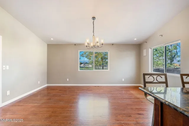 a view of a room with window wooden floor and windows