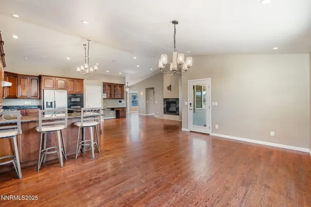 a view of a kitchen and dining table chairs