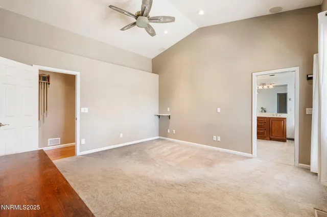 a view of a big room with wooden floor and cabinet