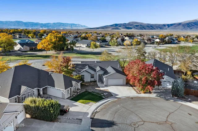 an aerial view of a house with a lake view