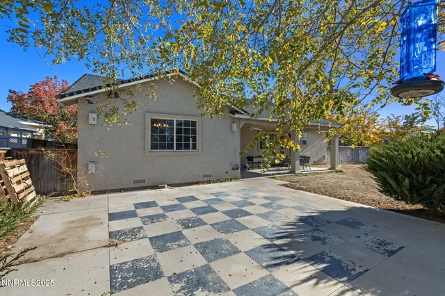 a house with a tree in front of it