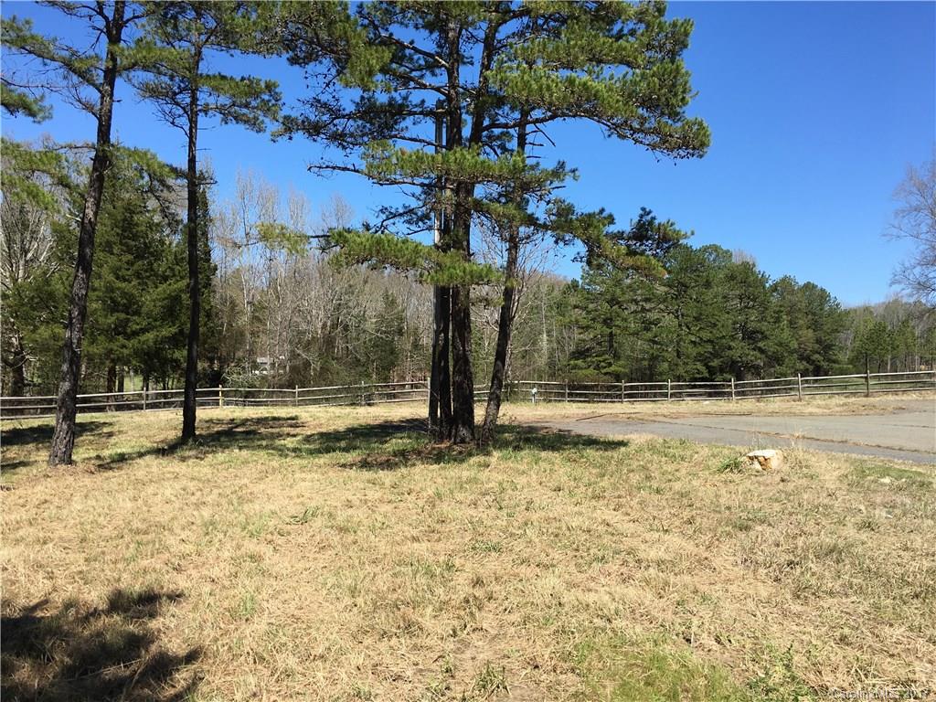 8002 New Town Road Waxhaw, NC 28173 - Photo 1 of 7 a view of a yard with wooden fence