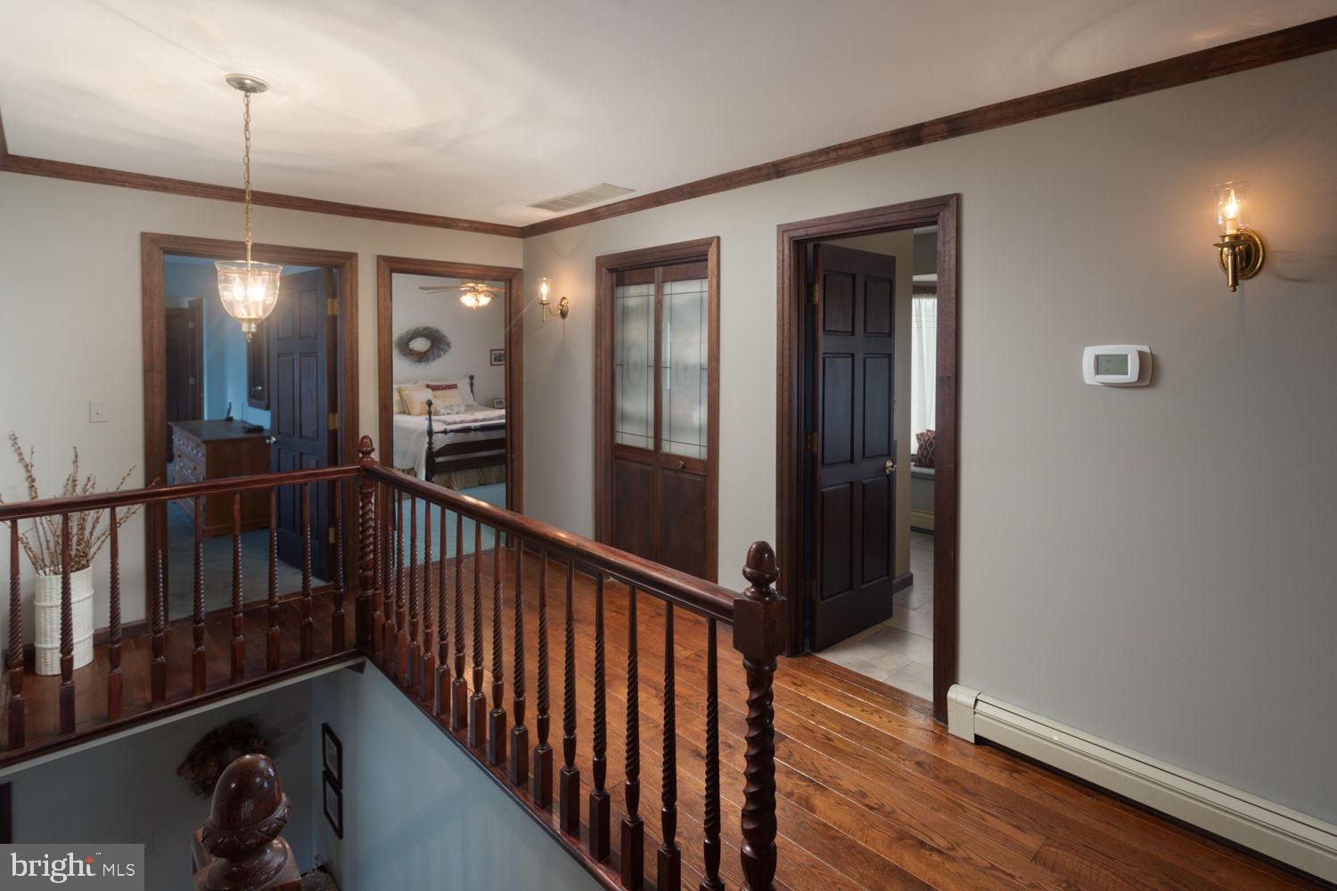 48 Harker Road Chesterfield, NJ 08515 - Photo 12 of 30 a view of a hallway with wooden floor and stairs