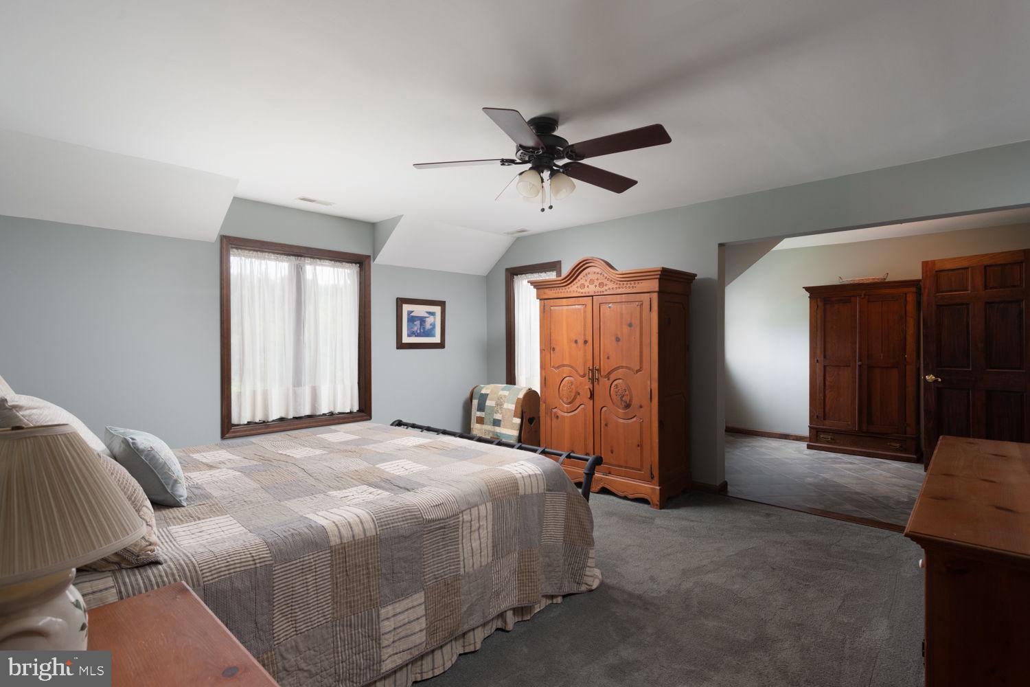 48 Harker Road Chesterfield, NJ 08515 - Photo 14 of 30 a bedroom with a bed and a mirror