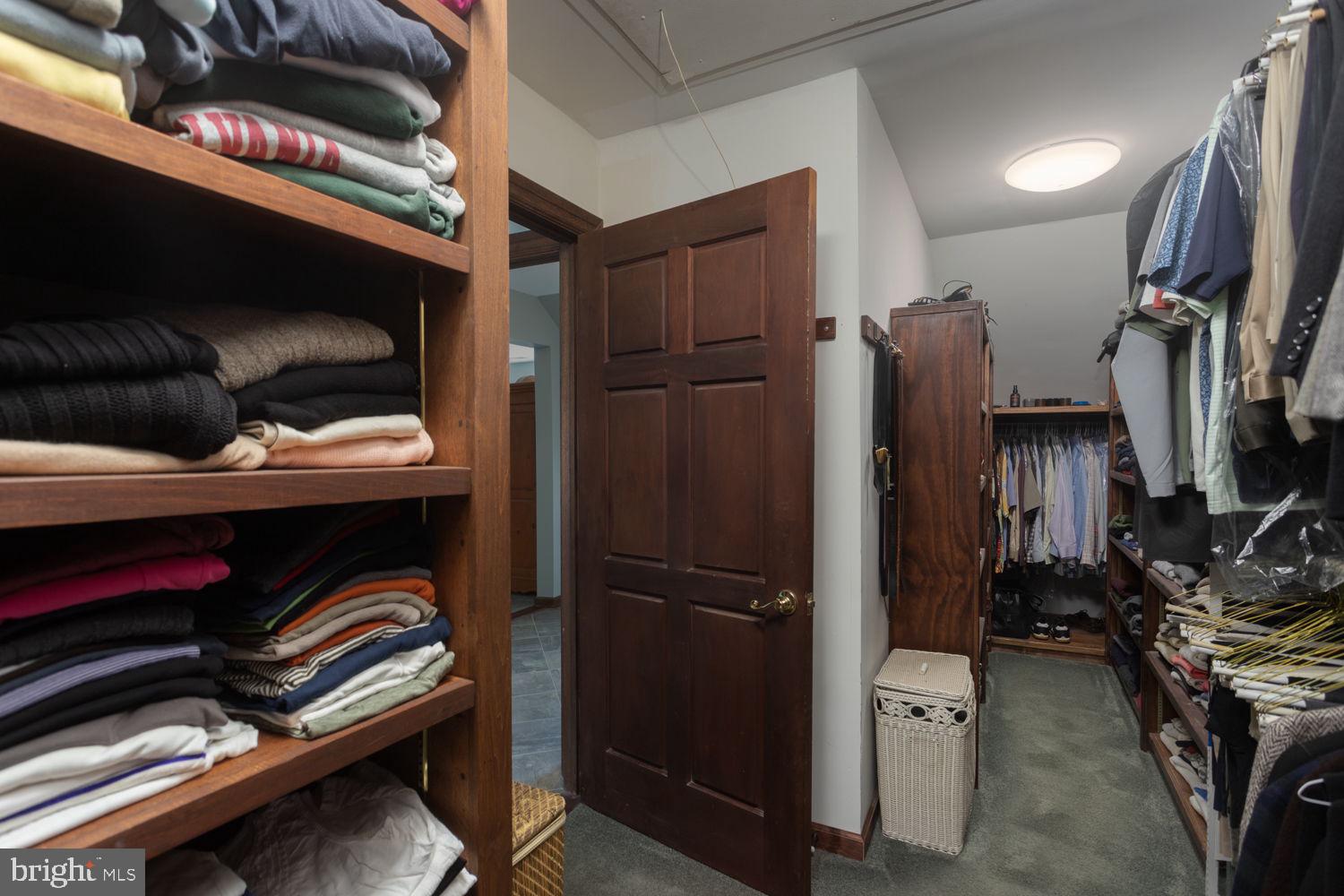 48 Harker Road Chesterfield, NJ 08515 - Photo 16 of 30 a view of walk in closet with clothes and shoes