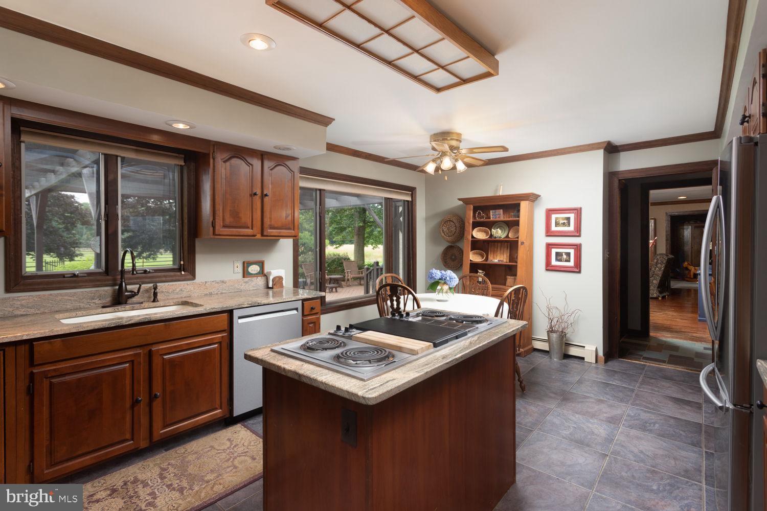 48 Harker Road Chesterfield, NJ 08515 - Photo 7 of 30 a kitchen with a sink stove and cabinets