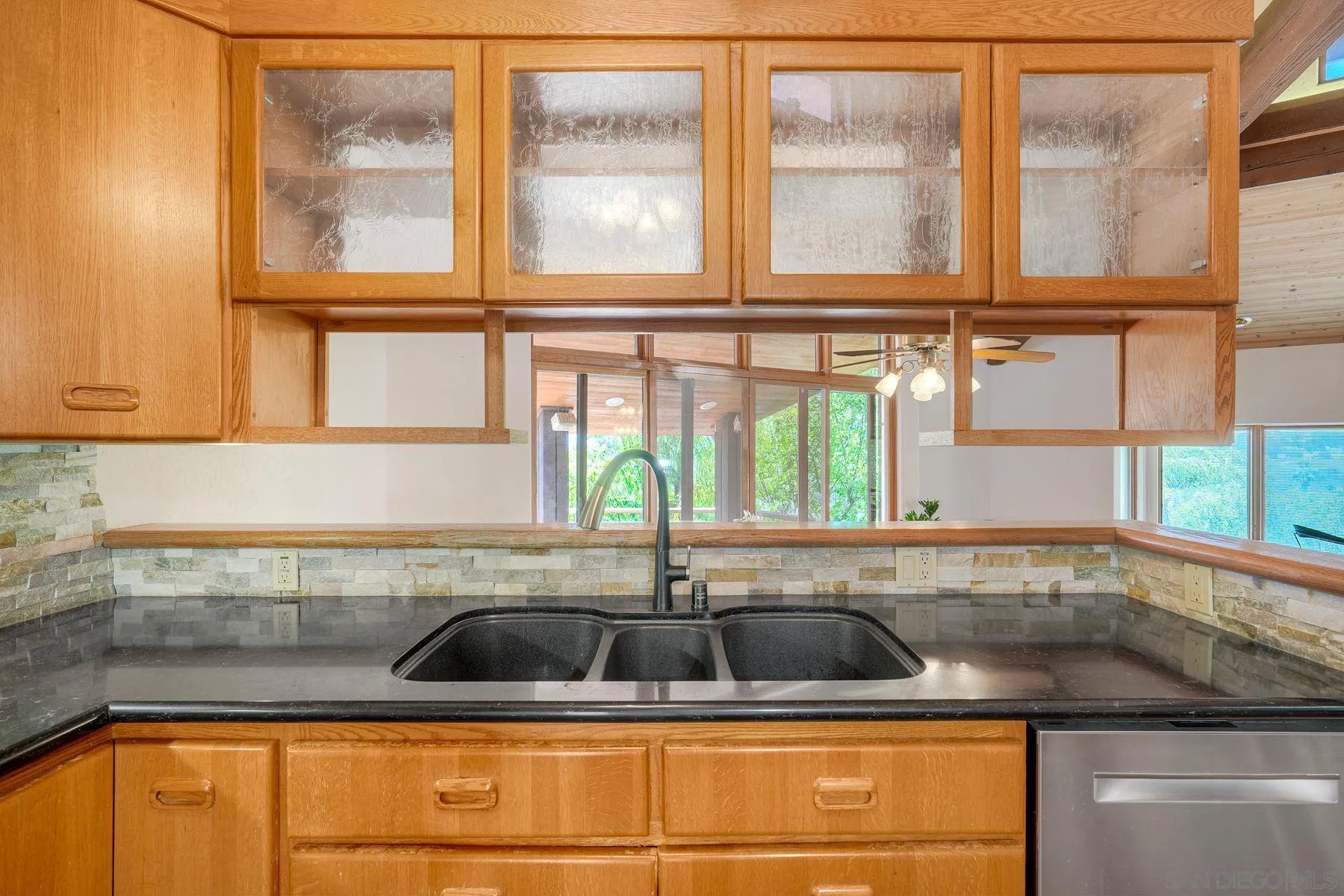 30458 Cool Valley Highlands Road Valley Center, CA 92082 - Photo 26 of 47 a kitchen with a sink and cabinets