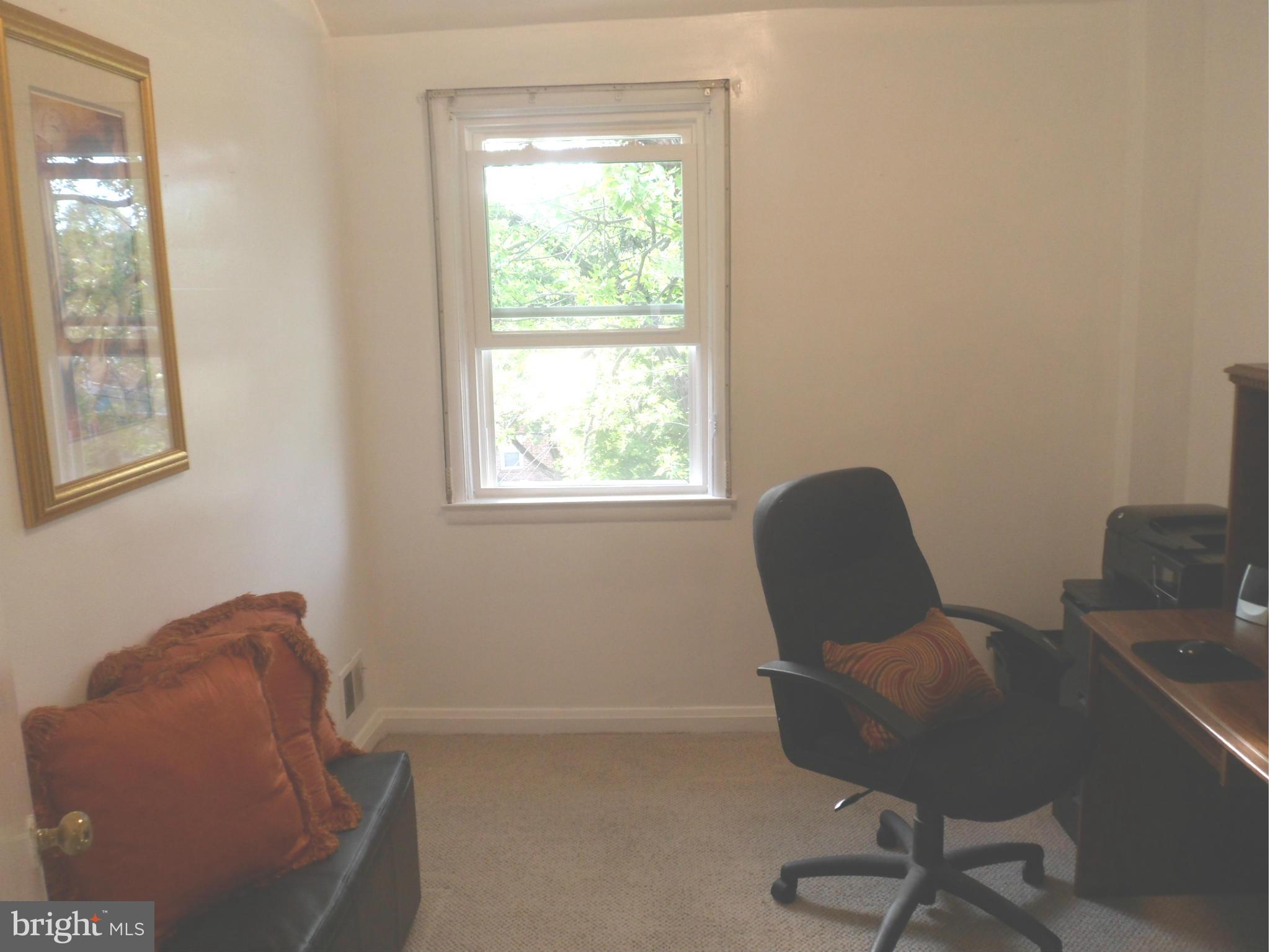 6110 Marlora Road Baltimore, MD 21239 - Photo 11 of 22 a workspace with furniture and a window