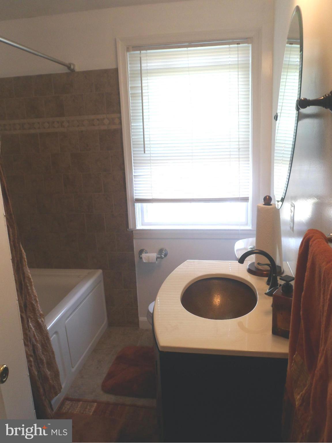 6110 Marlora Road Baltimore, MD 21239 - Photo 12 of 22 a bathroom with a sink and a toilet