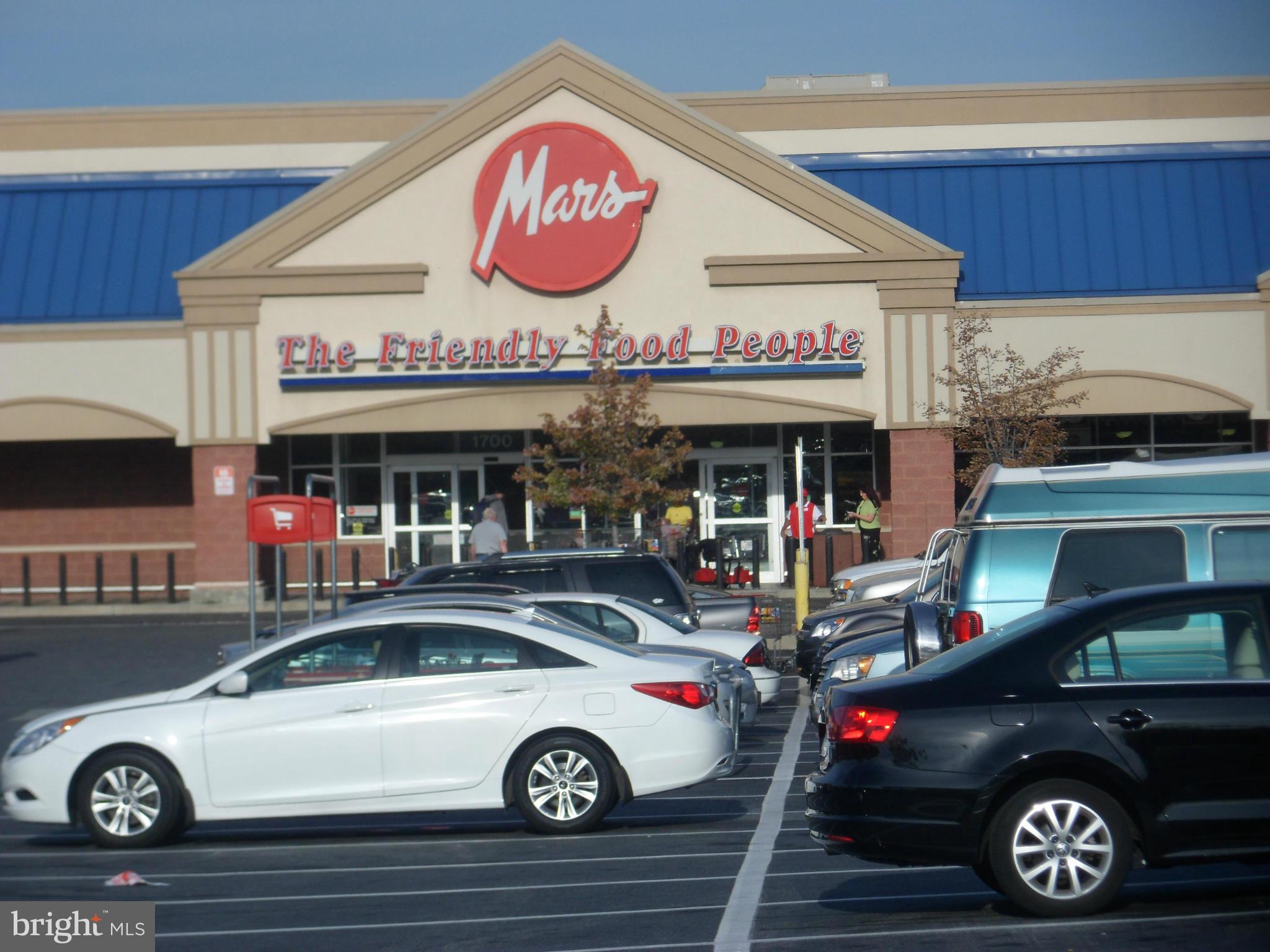 6110 Marlora Road Baltimore, MD 21239 - Photo 22 of 22 a car parked in front of a store