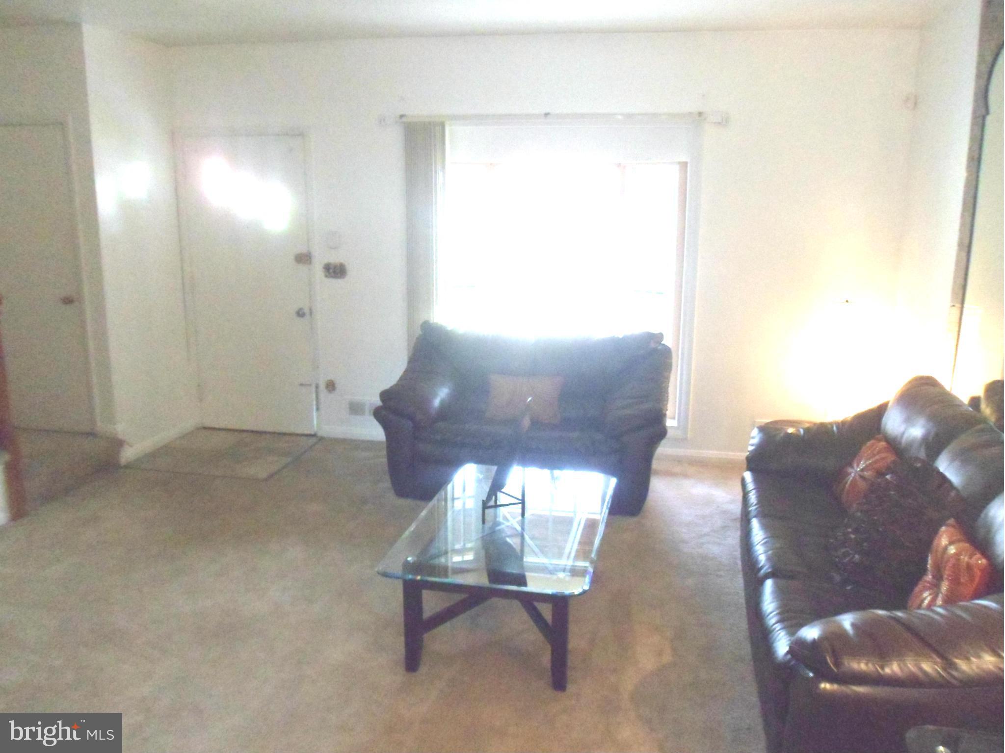 6110 Marlora Road Baltimore, MD 21239 - Photo 4 of 22 a living room with furniture and a window