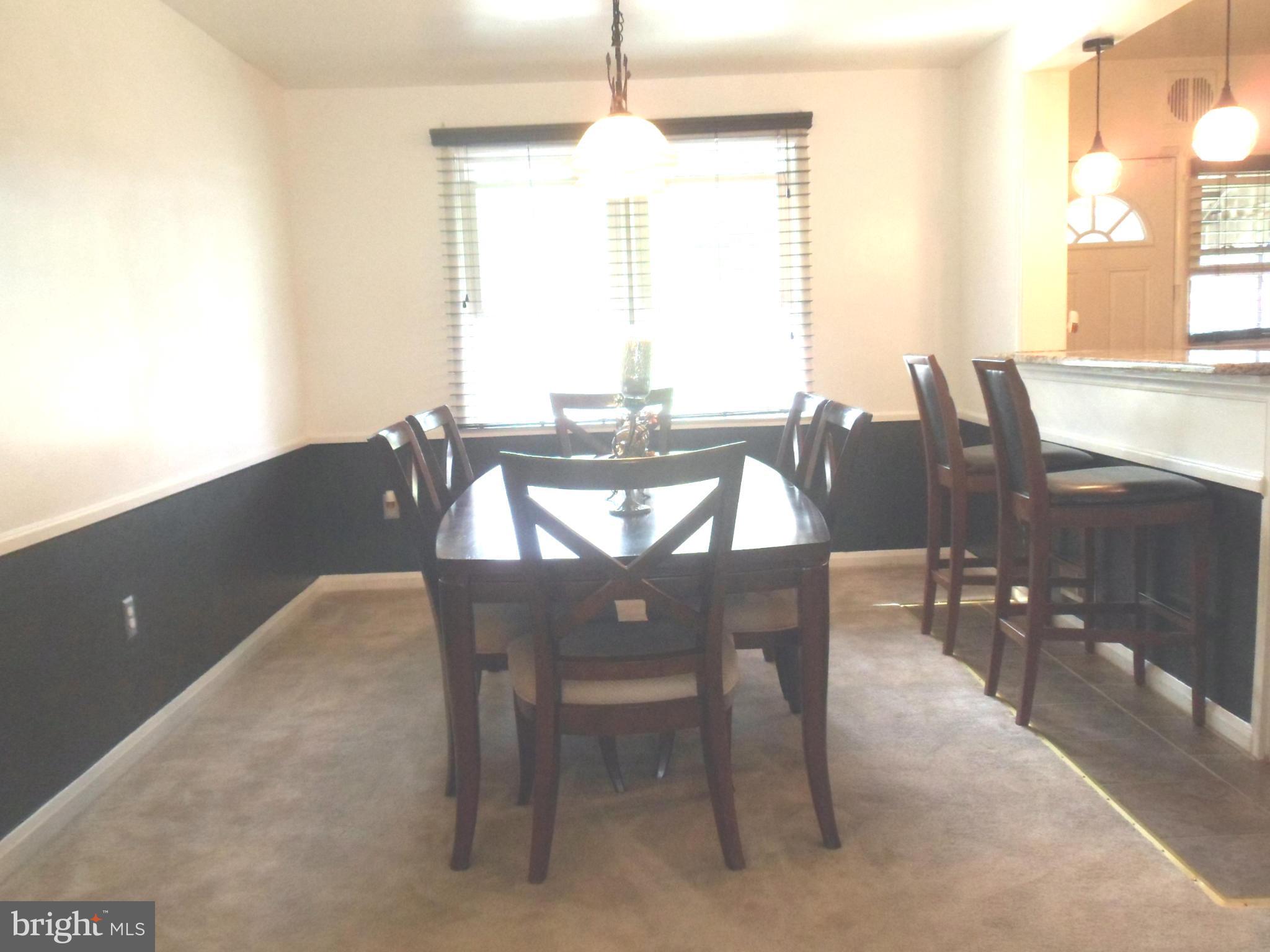 6110 Marlora Road Baltimore, MD 21239 - Photo 5 of 22 a view of a dining room with furniture window and outside view