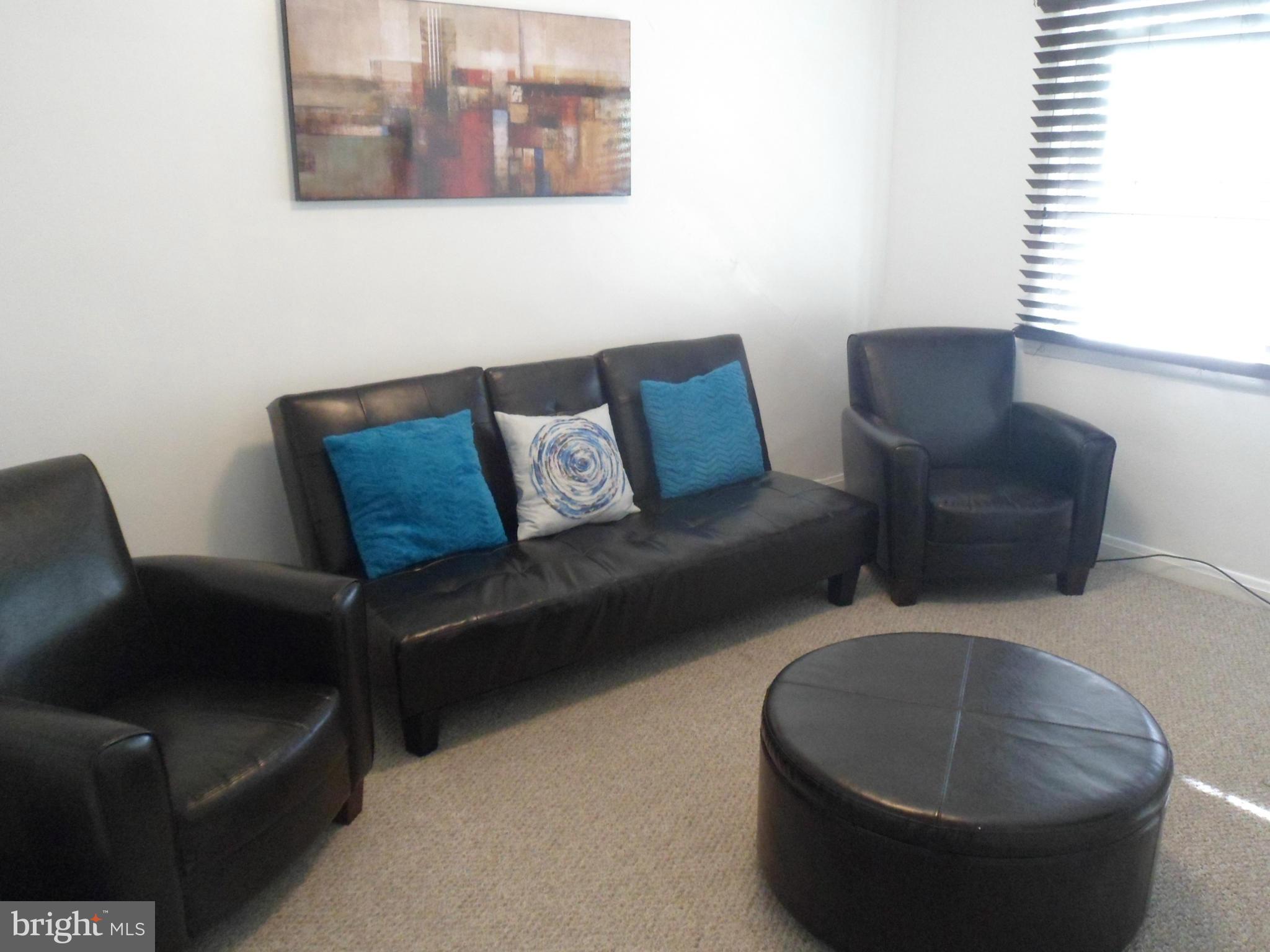 6110 Marlora Road Baltimore, MD 21239 - Photo 10 of 22 a living room with furniture and a window