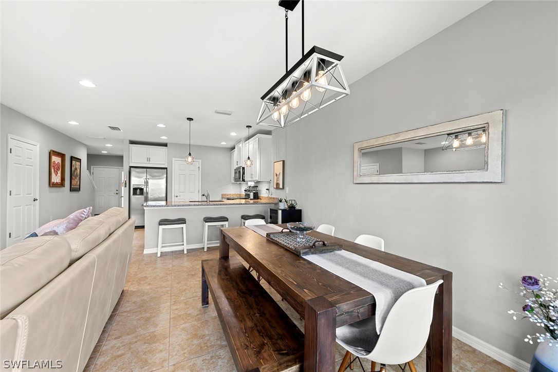 3849 Tilbor Circle Fort Myers, FL 33916 - Photo 12 of 28 a open kitchen with stainless steel appliances granite countertop a stove and a refrigerator