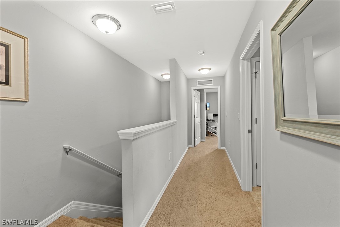 3849 Tilbor Circle Fort Myers, FL 33916 - Photo 15 of 28 a view of a hallway with white walls