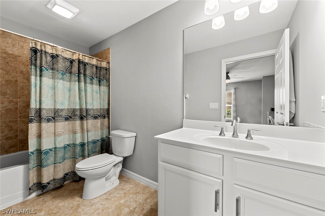 3849 Tilbor Circle Fort Myers, FL 33916 - Photo 18 of 28 a bathroom with a toilet sink and shower