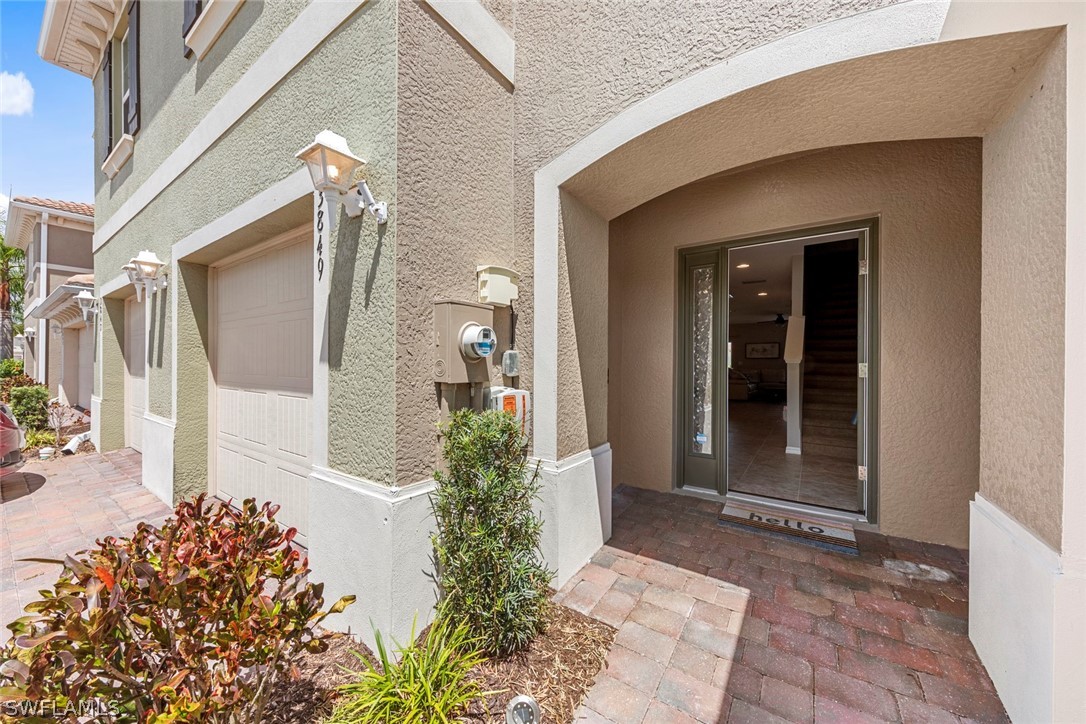 3849 Tilbor Circle Fort Myers, FL 33916 - Photo 2 of 28 a front view of a house with an outdoor space