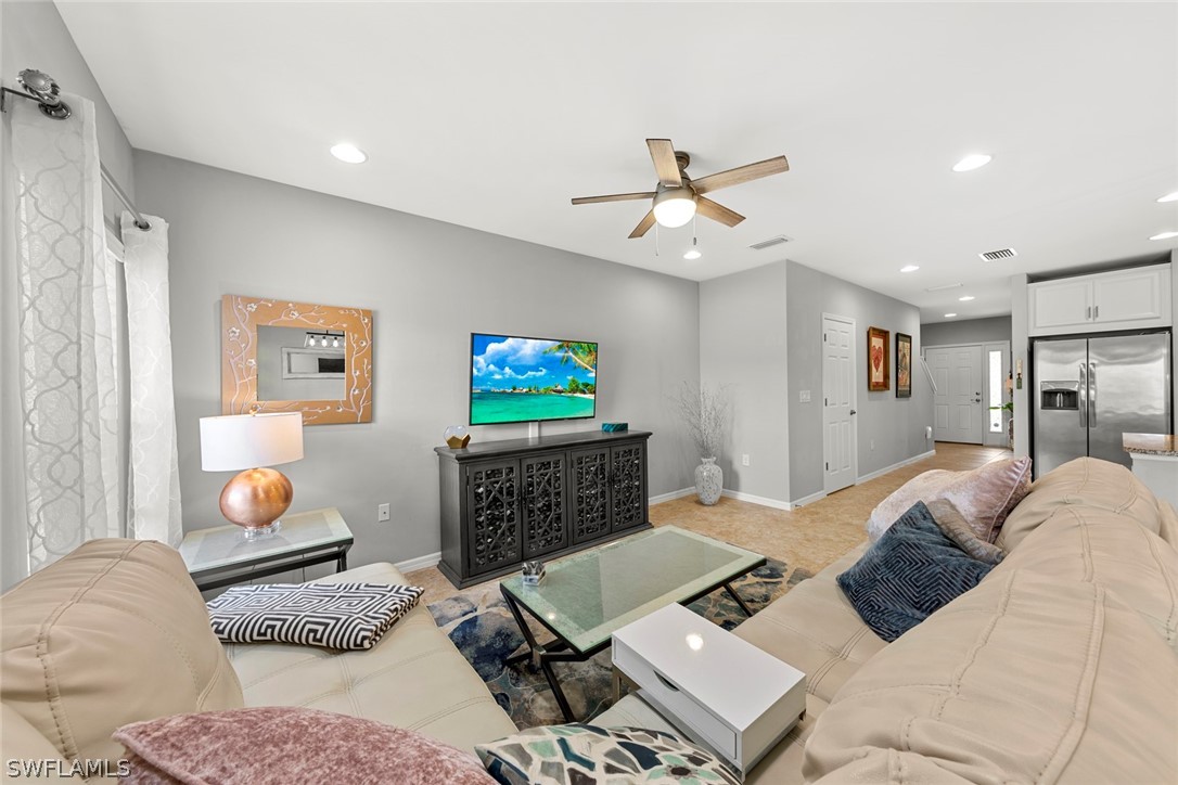3849 Tilbor Circle Fort Myers, FL 33916 - Photo 10 of 28 a living room with furniture and a flat screen tv