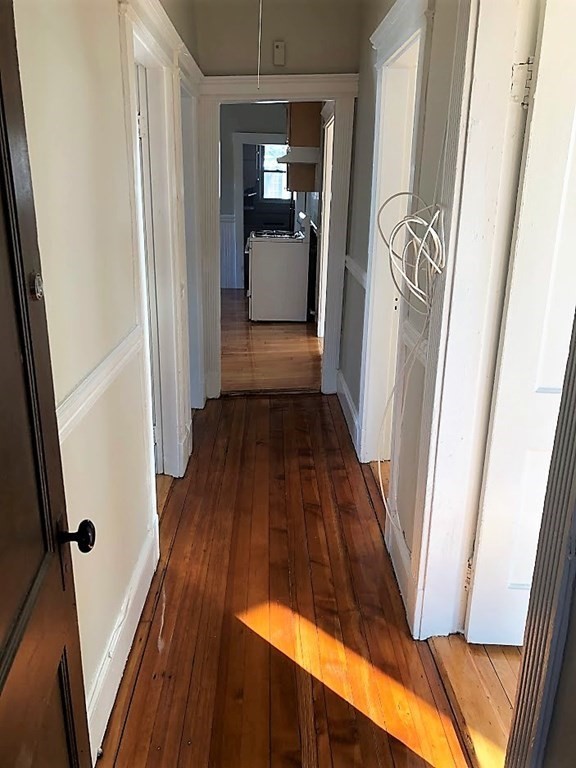 19 Arden Street, Unit 2 Boston, MA 02134 - Photo 3 of 8 a view of a hallway view with wooden floor and staircase