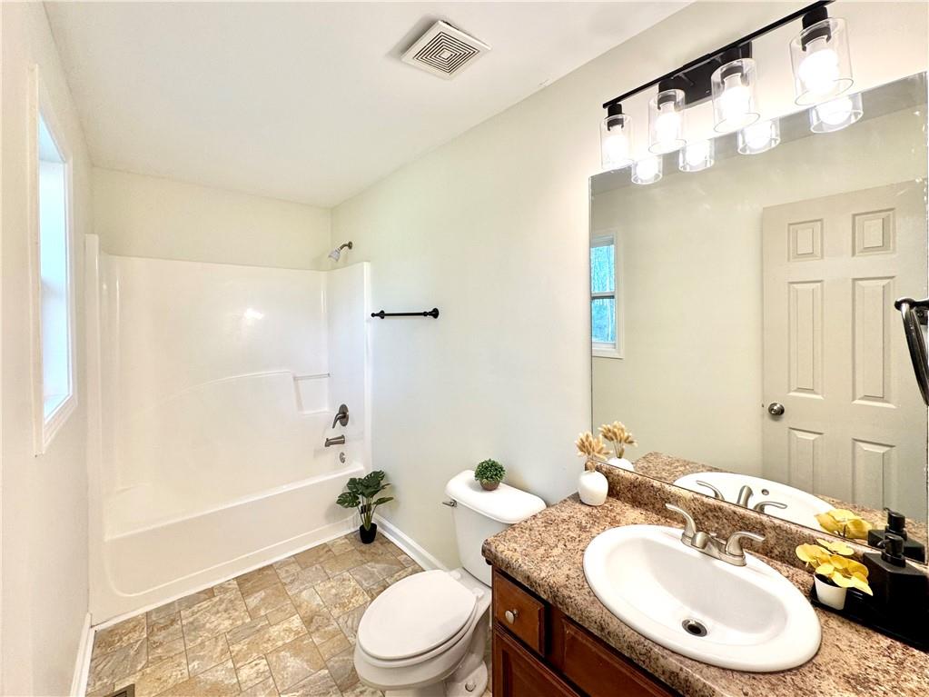 636 Hardy Way Hiram, GA 30141 - Photo 12 of 27 a bathroom with a sink a toilet and shower