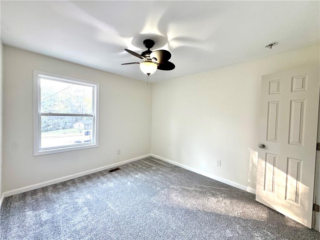 636 Hardy Way Hiram, GA 30141 - Photo 13 of 27 a view of an empty room with a window