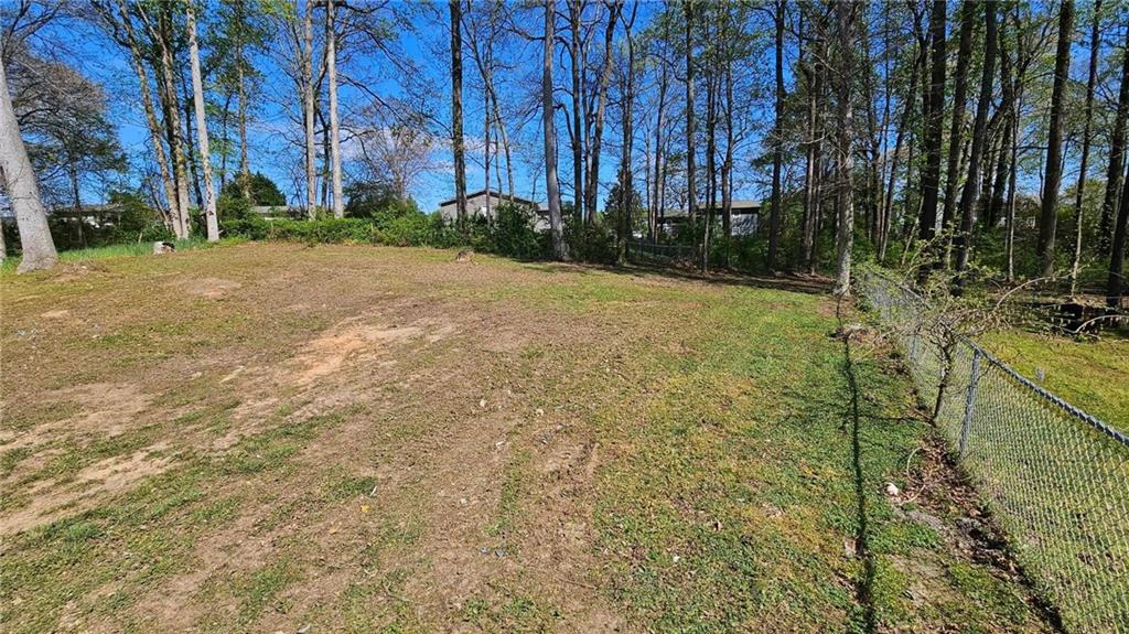 636 Hardy Way Hiram, GA 30141 - Photo 17 of 27 a view of a backyard with large trees