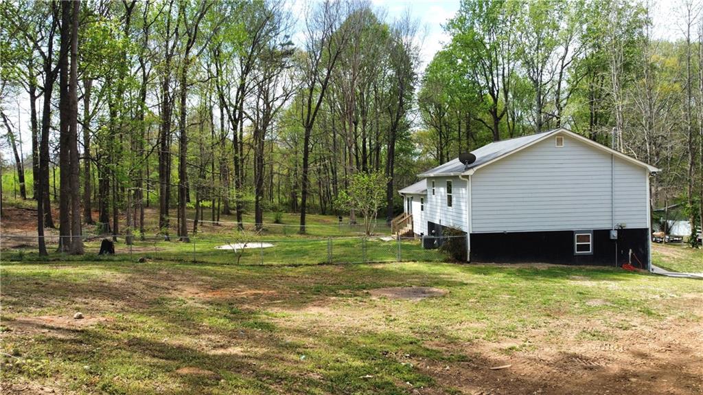636 Hardy Way Hiram, GA 30141 - Photo 20 of 27 a front view of a house with a yard