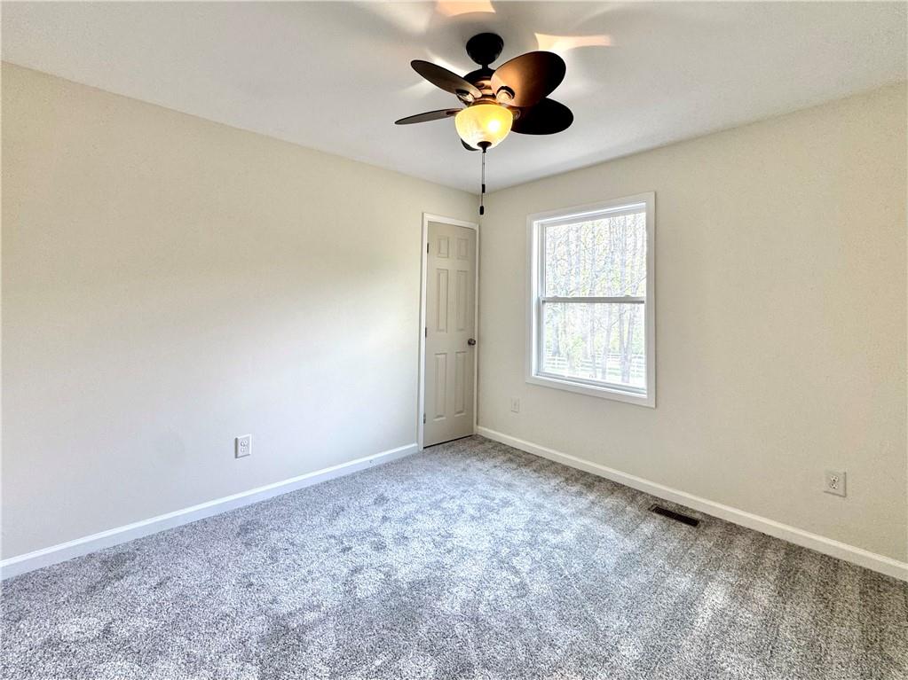 636 Hardy Way Hiram, GA 30141 - Photo 8 of 27 a view of an empty room with a window