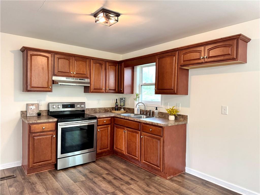 636 Hardy Way Hiram, GA 30141 - Photo 9 of 27 a kitchen with stainless steel appliances granite countertop a stove sink and cabinets