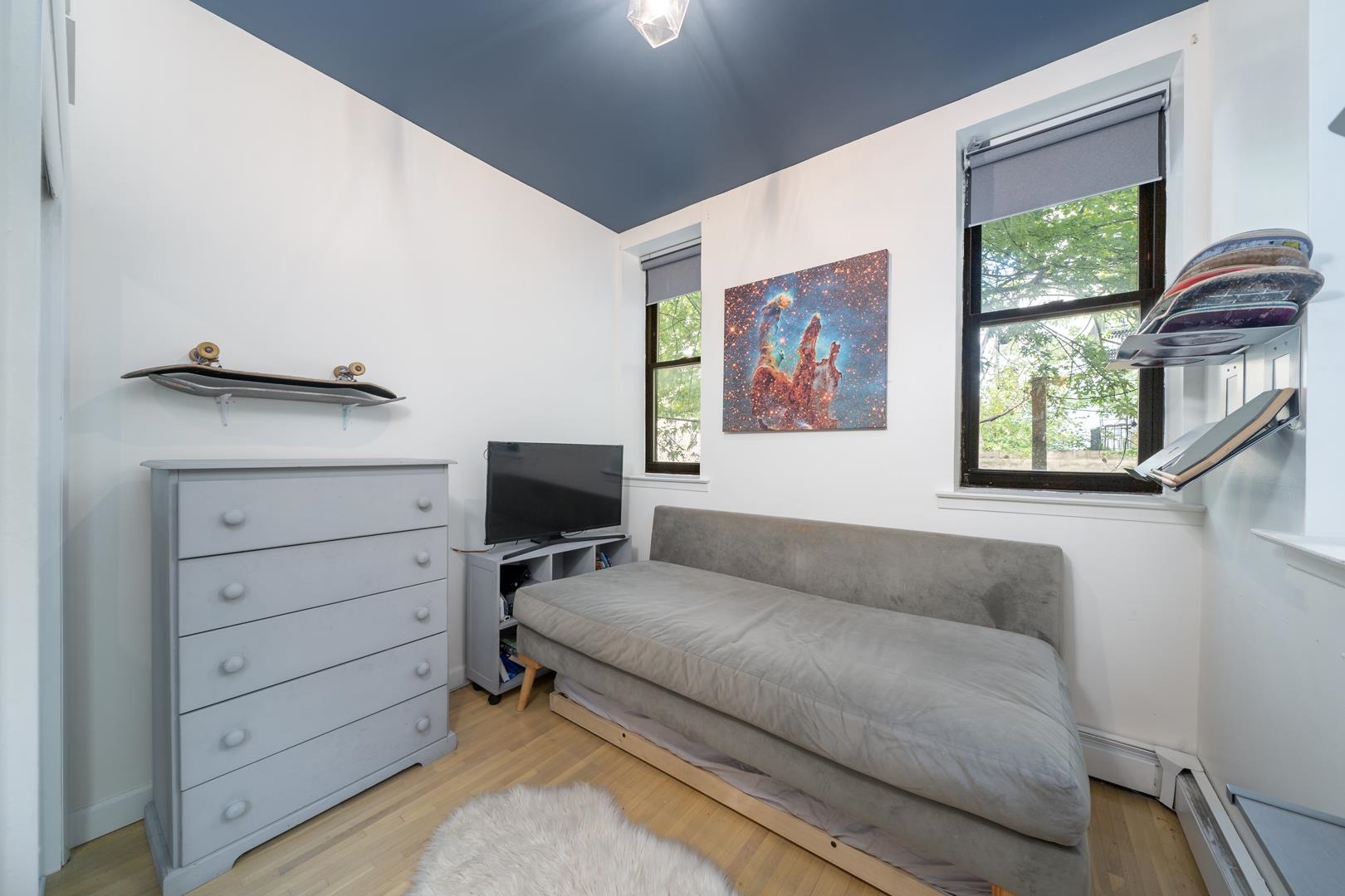 554 Observer Highway, Unit 1R Hoboken, NJ 07030 - Photo 12 of 21 a living room with furniture and a window