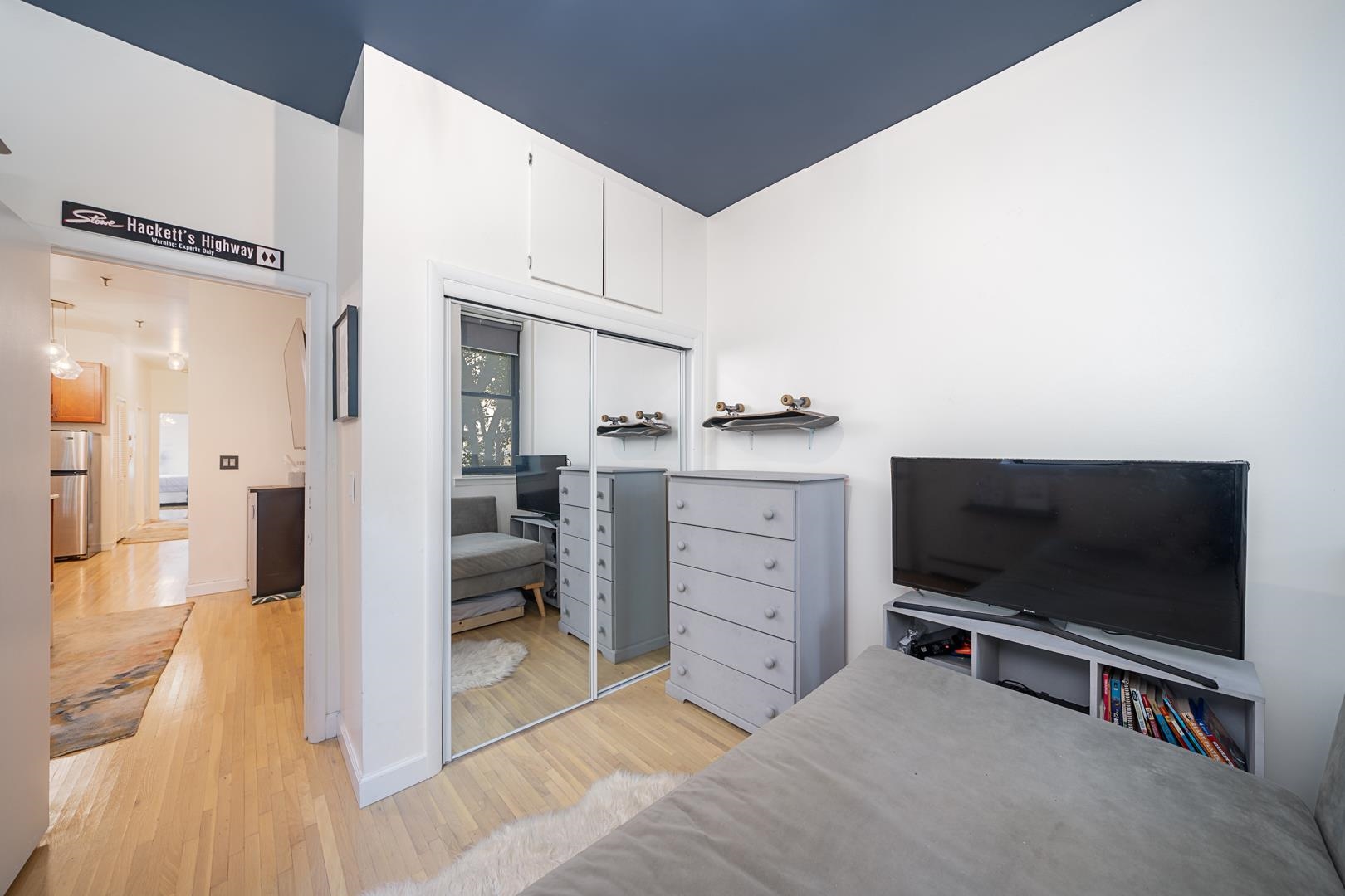 554 Observer Highway, Unit 1R Hoboken, NJ 07030 - Photo 13 of 21 a living room with furniture and a flat screen tv