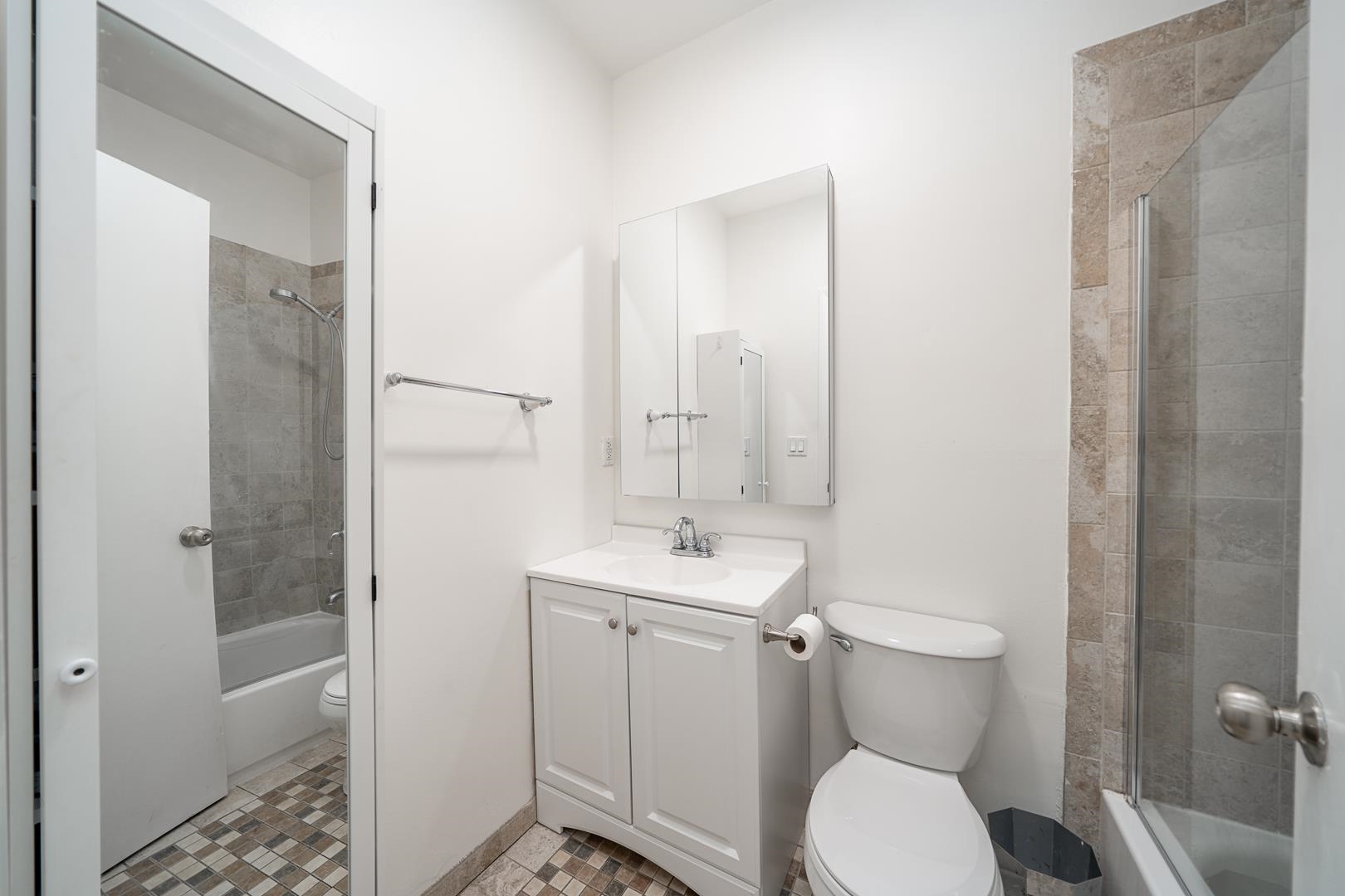 554 Observer Highway, Unit 1R Hoboken, NJ 07030 - Photo 14 of 21 a bathroom with a toilet sink and shower