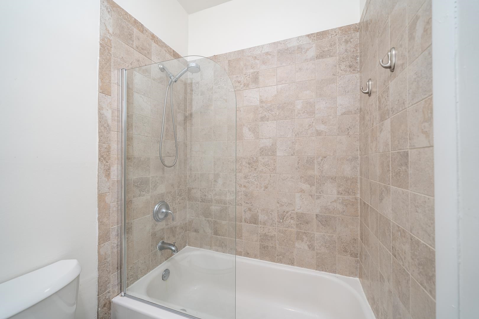 554 Observer Highway, Unit 1R Hoboken, NJ 07030 - Photo 15 of 21 a bathroom with a tub and shower