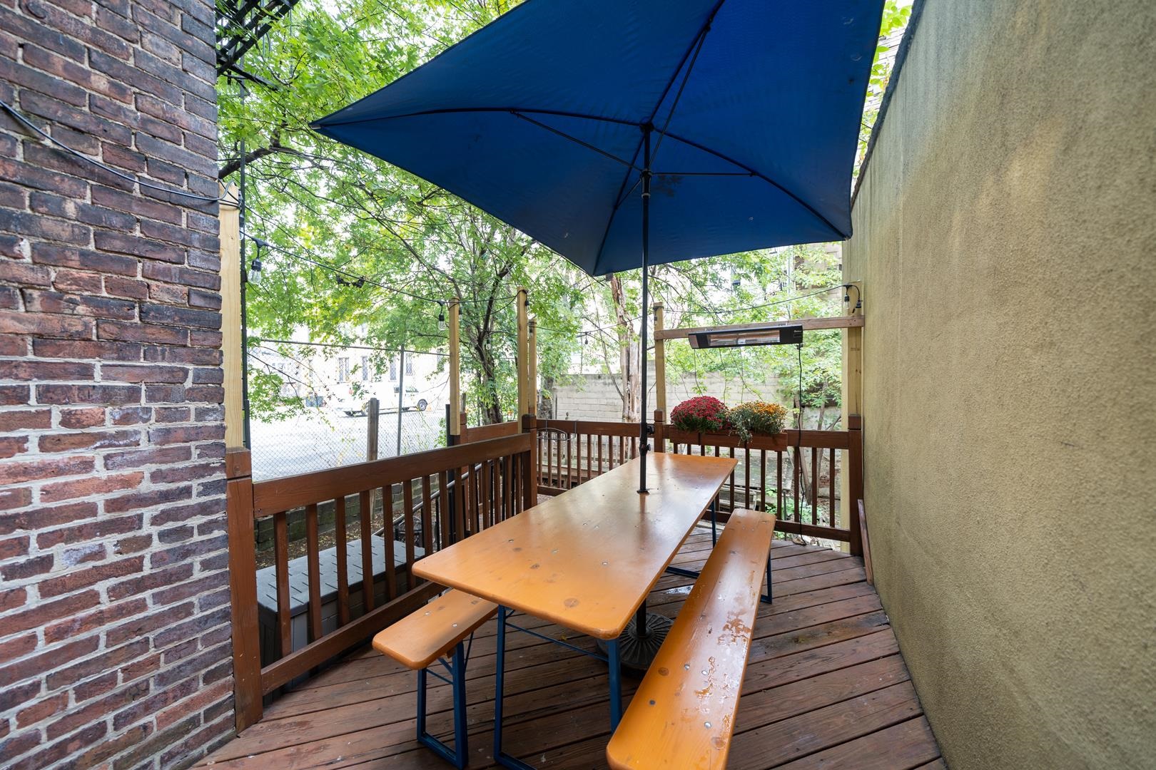 554 Observer Highway, Unit 1R Hoboken, NJ 07030 - Photo 16 of 21 a balcony with wooden floor and outdoor seating