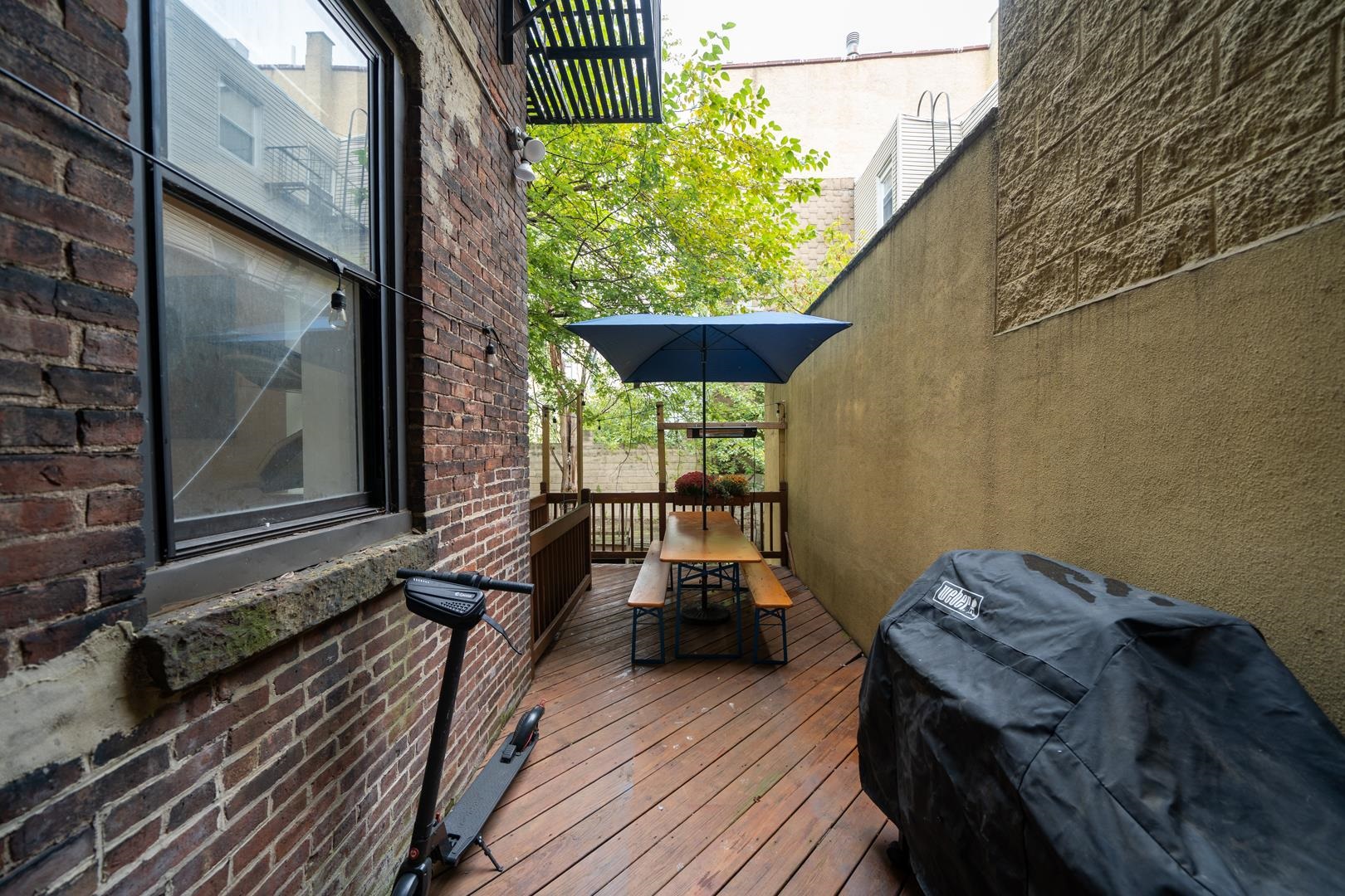554 Observer Highway, Unit 1R Hoboken, NJ 07030 - Photo 18 of 21 a view of a balcony with chairs and wooden floor