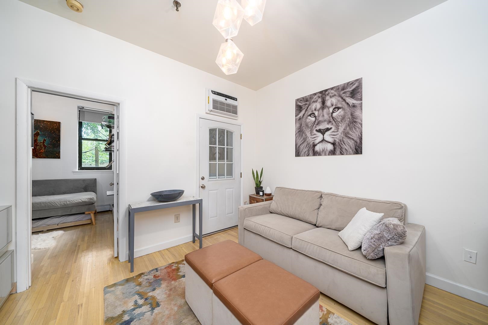 554 Observer Highway, Unit 1R Hoboken, NJ 07030 - Photo 4 of 21 a living room with furniture and a couch