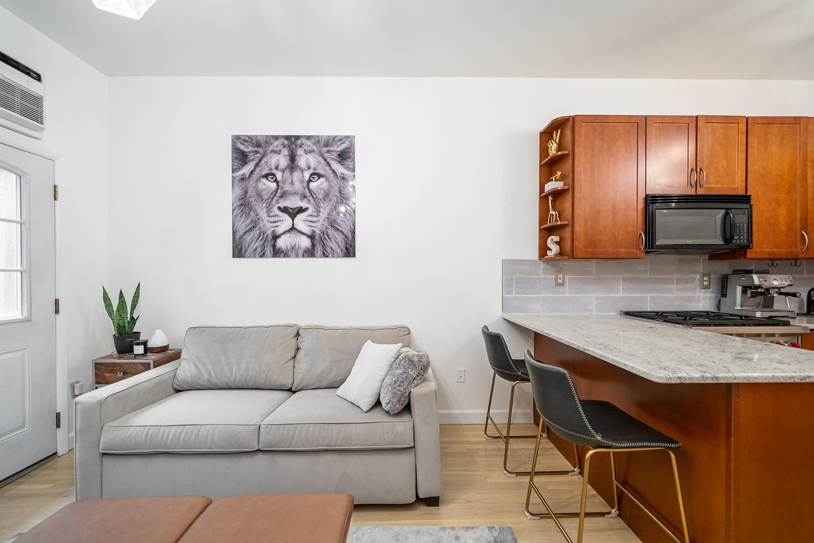 554 Observer Highway, Unit 1R Hoboken, NJ 07030 - Photo 7 of 21 a living room with furniture and a large mirror
