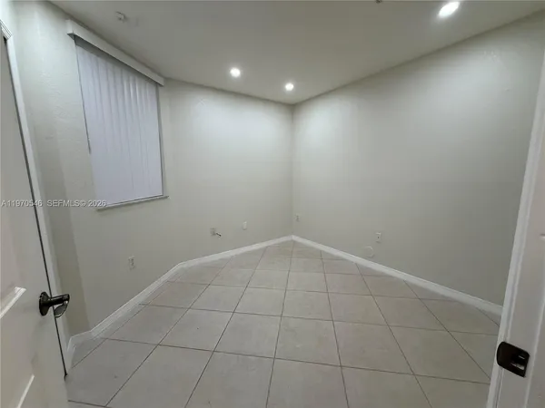 an empty room with closet area