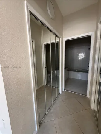 a bathroom with a sink and a mirror or bathtub