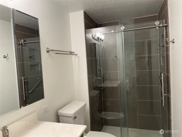 a bedroom with a large bed and a large window