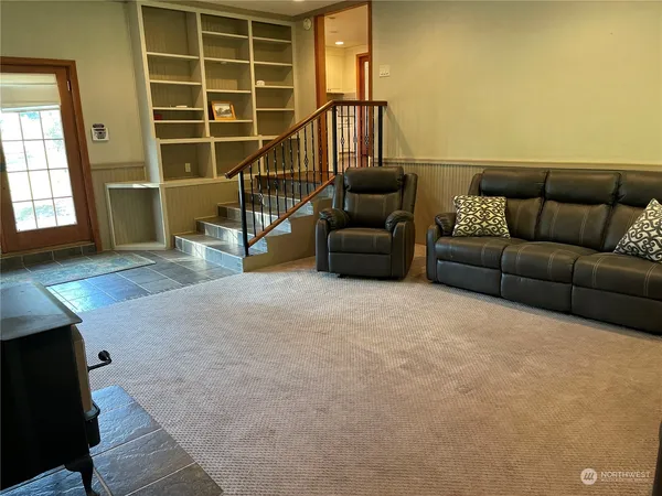 a living room with furniture and a window