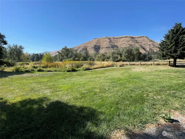 a backyard of a house with lots of green space