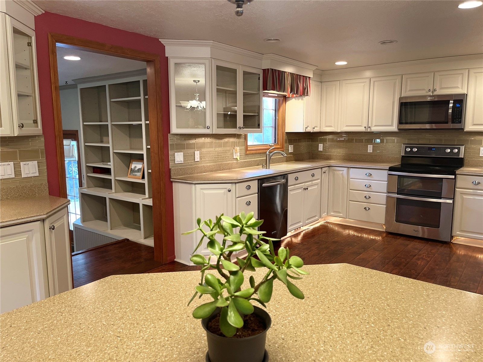 103 Wolf Fork Road Dayton, WA 99328 - Photo 4 of 40 a kitchen with stainless steel appliances a stove a sink a microwave and cabinets