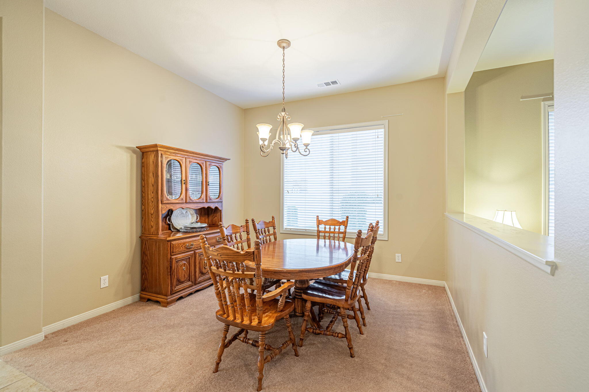 6827 Cabernet Road Palmdale, CA 93551 - Photo 31 of 50 a view of a dining room with furniture and window