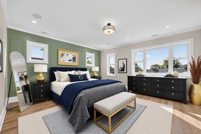 a spacious bedroom with a bed and a dresser