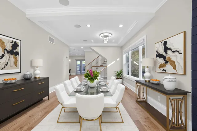 a view of a dining room with furniture and wooden floor